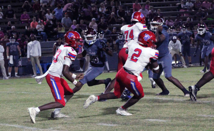 Miequle Brock takes the handoff